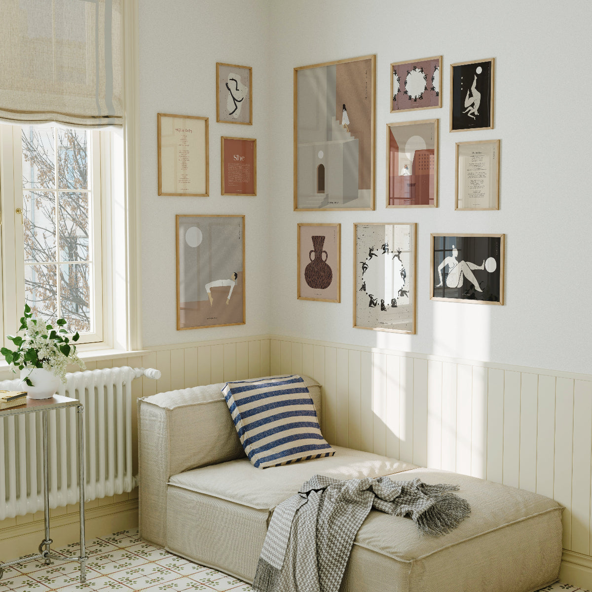 Cozy living room with a beige sofa, striped pillow, and framed artwork on the wall.