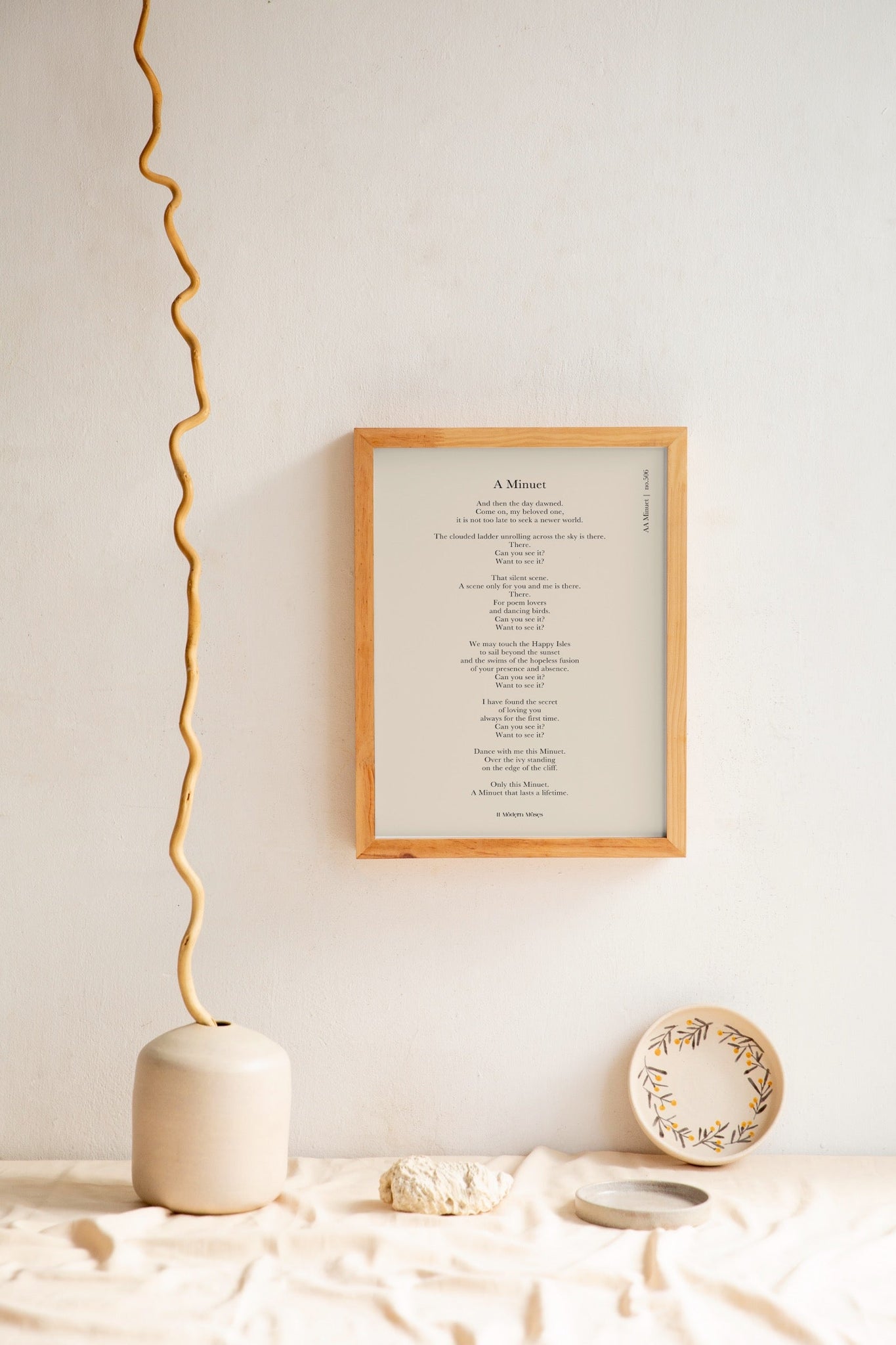 A wooden frame of a poemprint "a Minuet" to inspire you daily