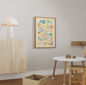 Children's room with a colorful alphabet poster on the wall, wooden furniture, and toys.