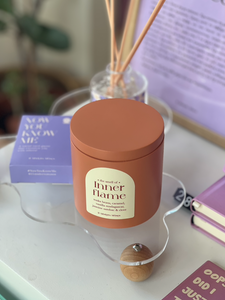 Ceramic diffuser with 'Inner Flame' label on a surface with blurred background