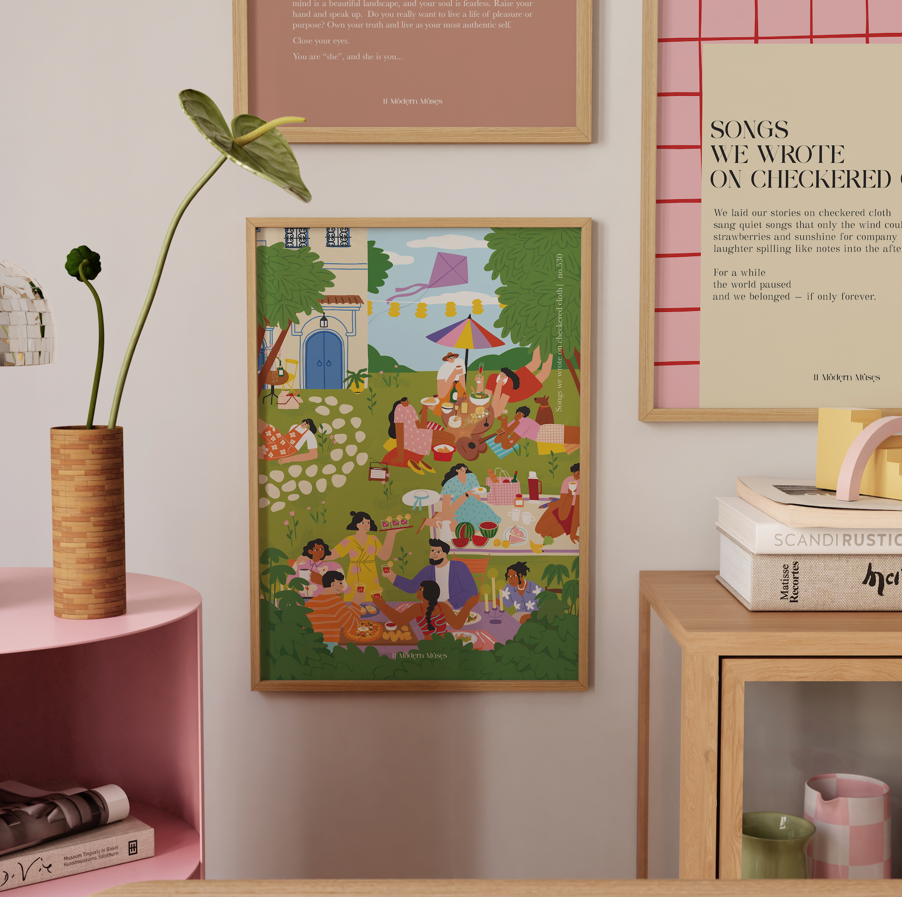 Framed artwork of a colorful scene with people at a picnic on a wall in a room with decor elements.
