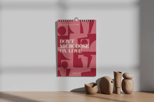 Red calendar 2026 with text on a wooden surface with decorative vases